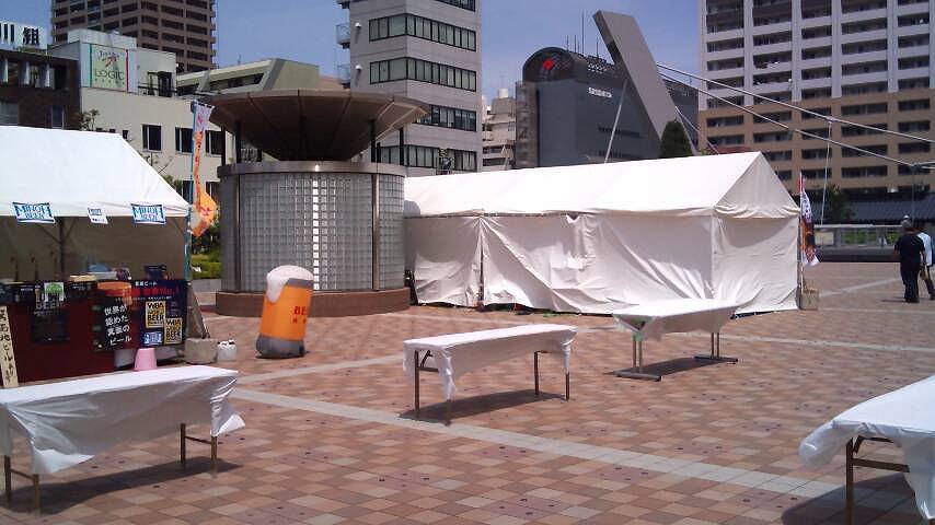 In middle of setting up a beer garden on a public square